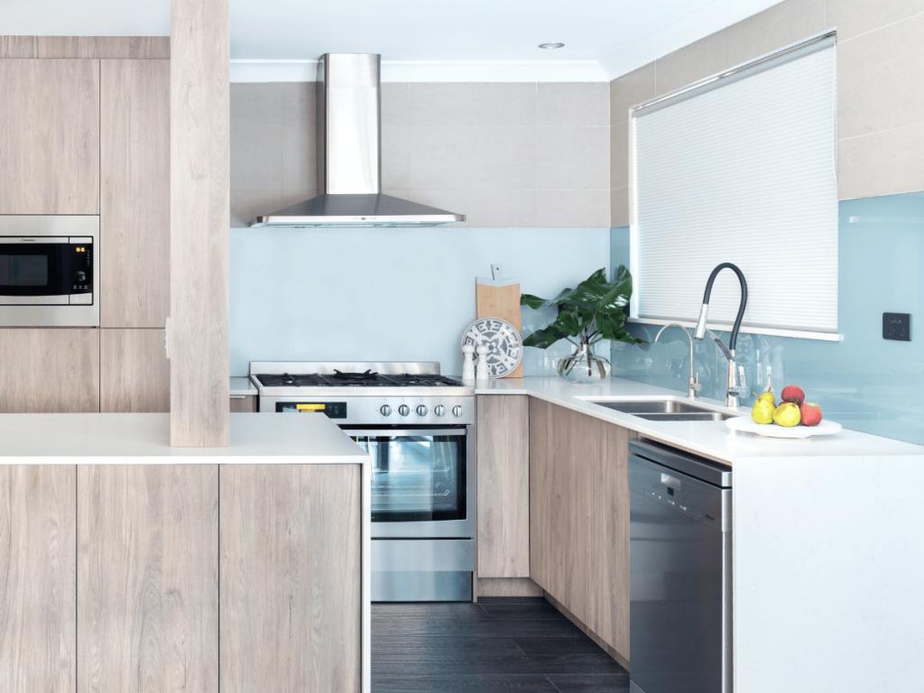 blue glass splashback in coastal kitchen
